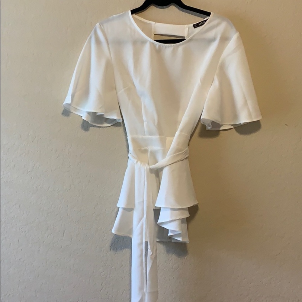 Light white blouse with open back concept